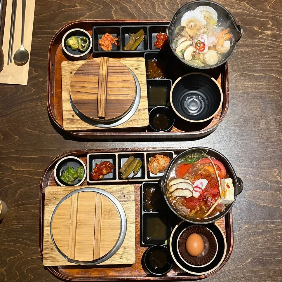 The set meal beginning to be laid out on the table