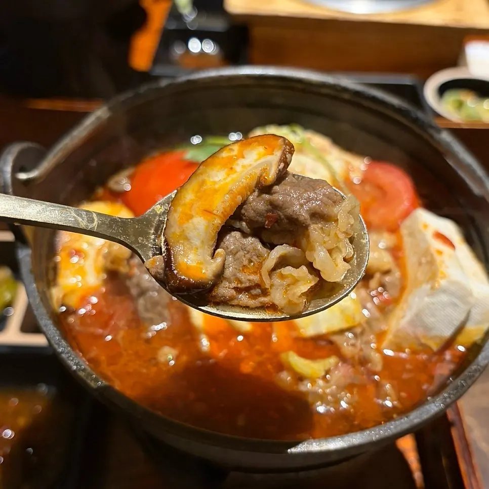 Spicy tomato hot pot loaded with beef brisket