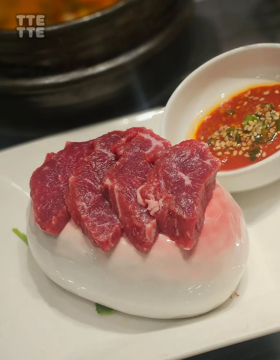 Fresh beef tartare (yuk-sashimi) served alongside the meal