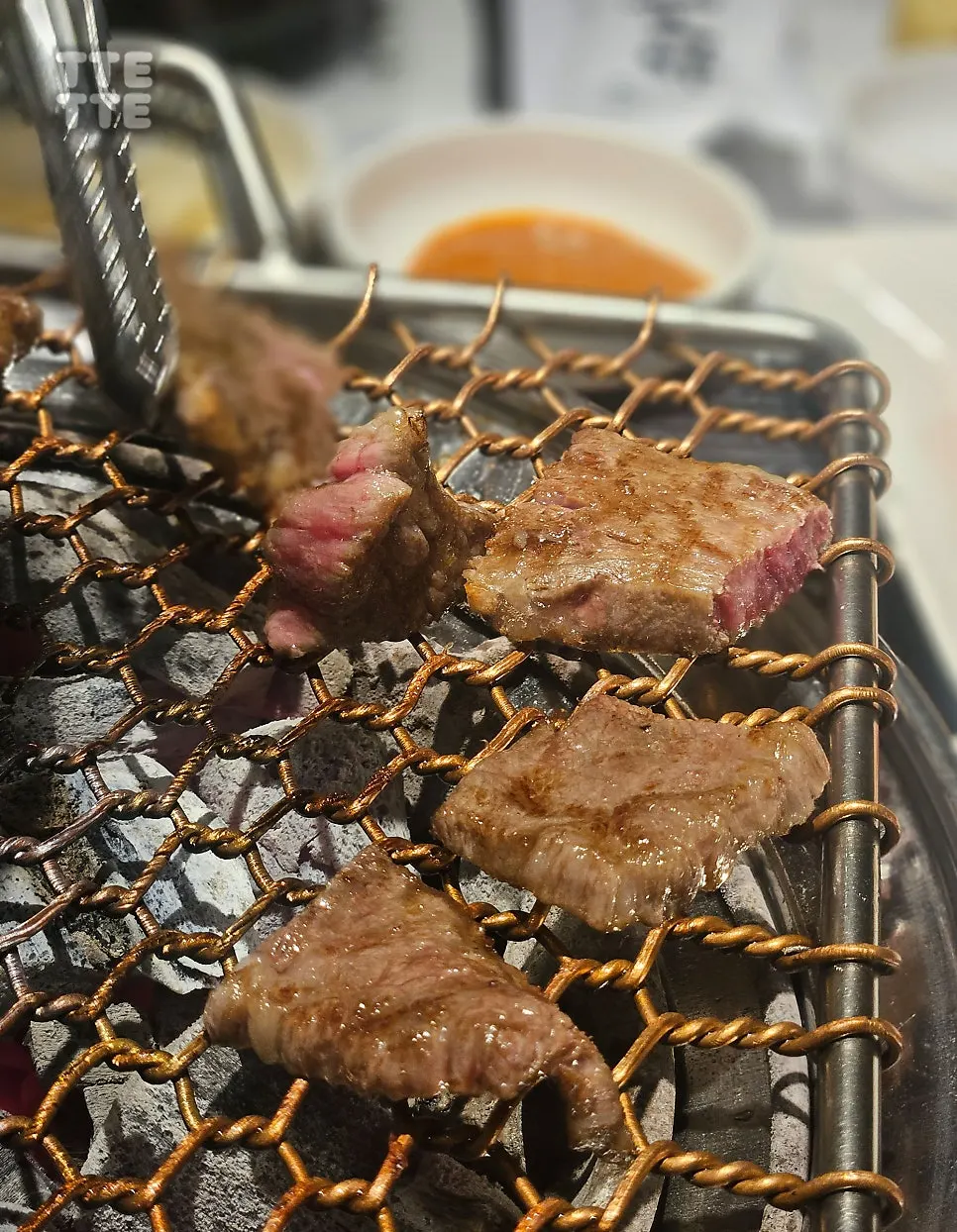 Garlic cooking in garlic oil sauce on the grill plate