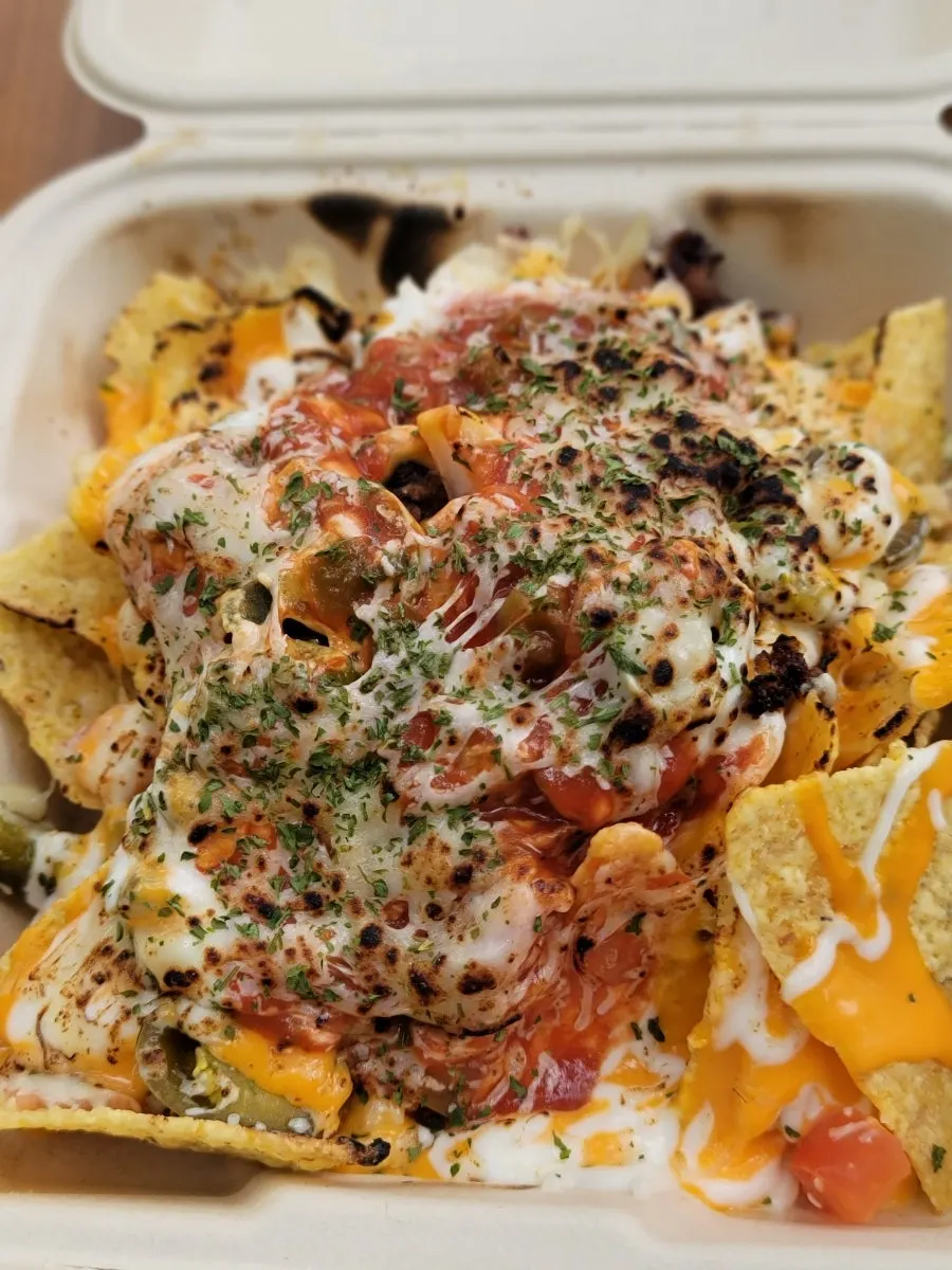 Crushing the nachos with a spoon