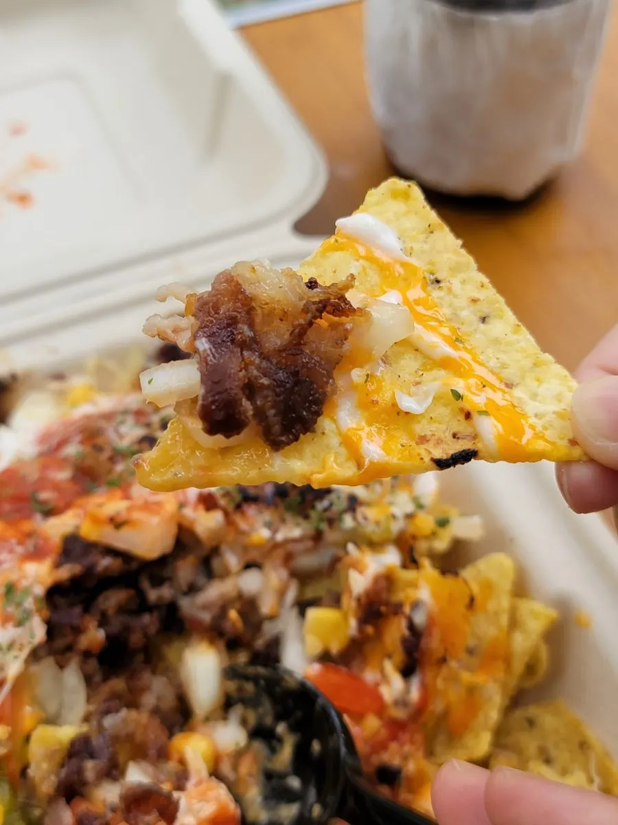 A plate of smoky beef brisket nachos
