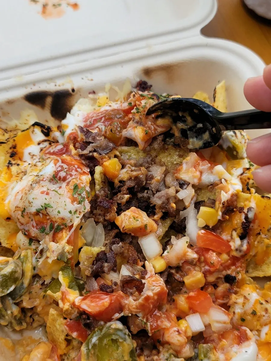 Enjoying nachos together with red wine