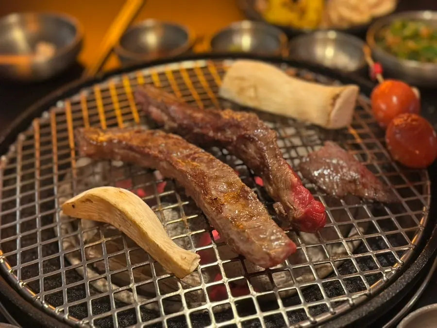 Seasoned gadak galbi on the grill