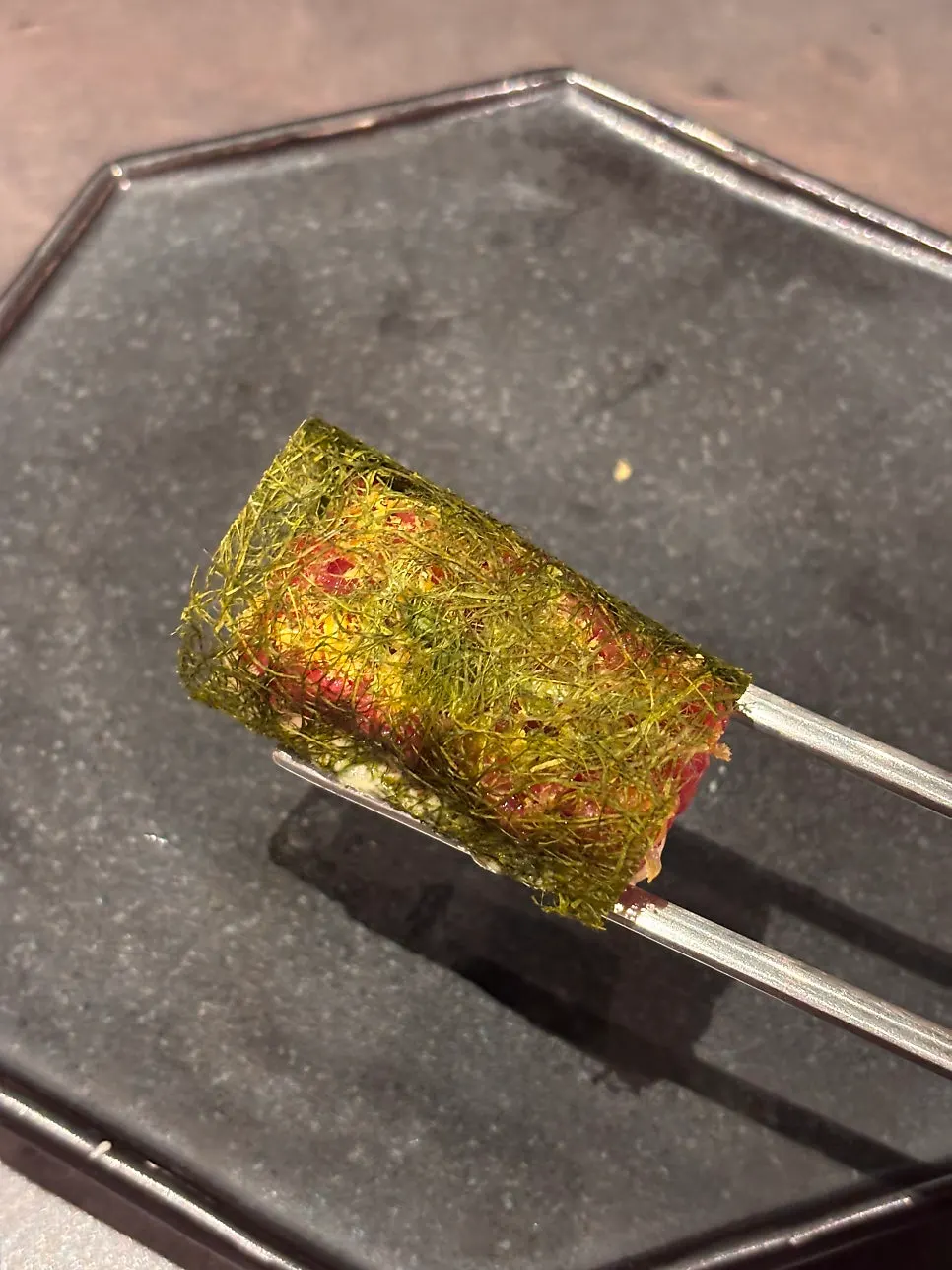 Close-up of hanwoo yukhoe gamtae topped with cured egg