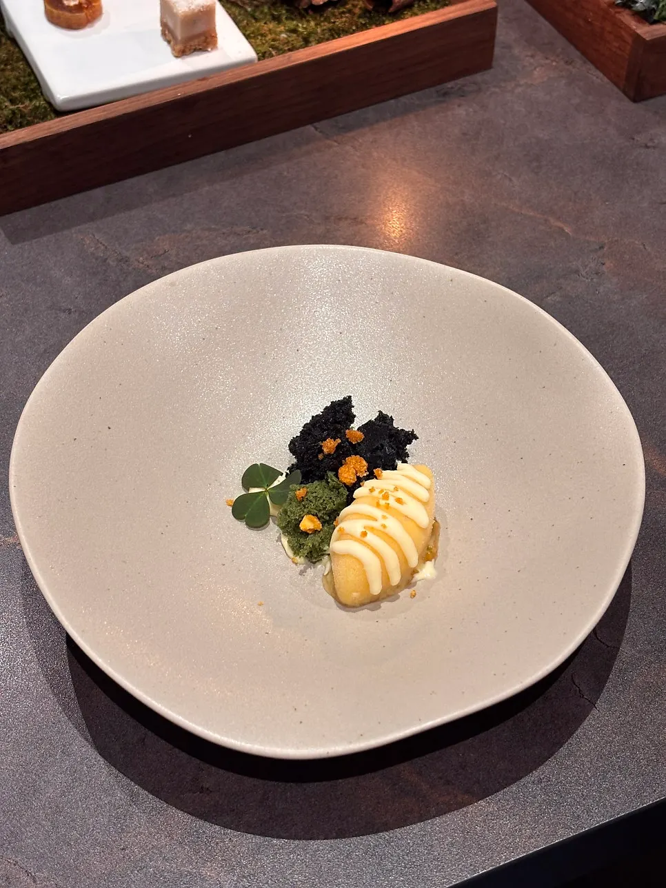 Basic dessert of corn ice cream and green tangerine cream sauce