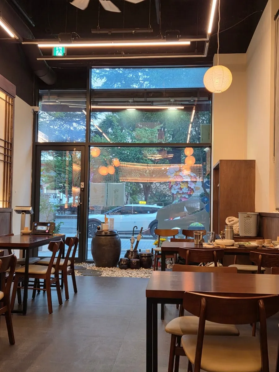 Interior of Usul with deep wood tones and soft lighting