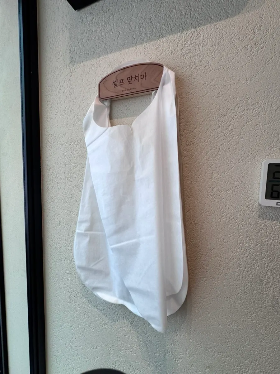 Sign for the gender-separated restrooms inside the restaurant