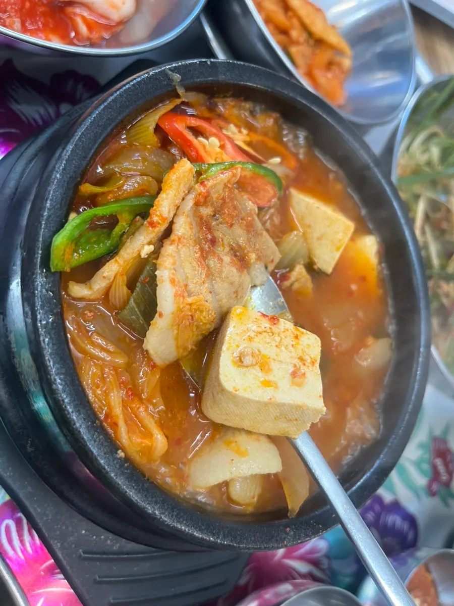 Free kimchi jjigae served with the meal