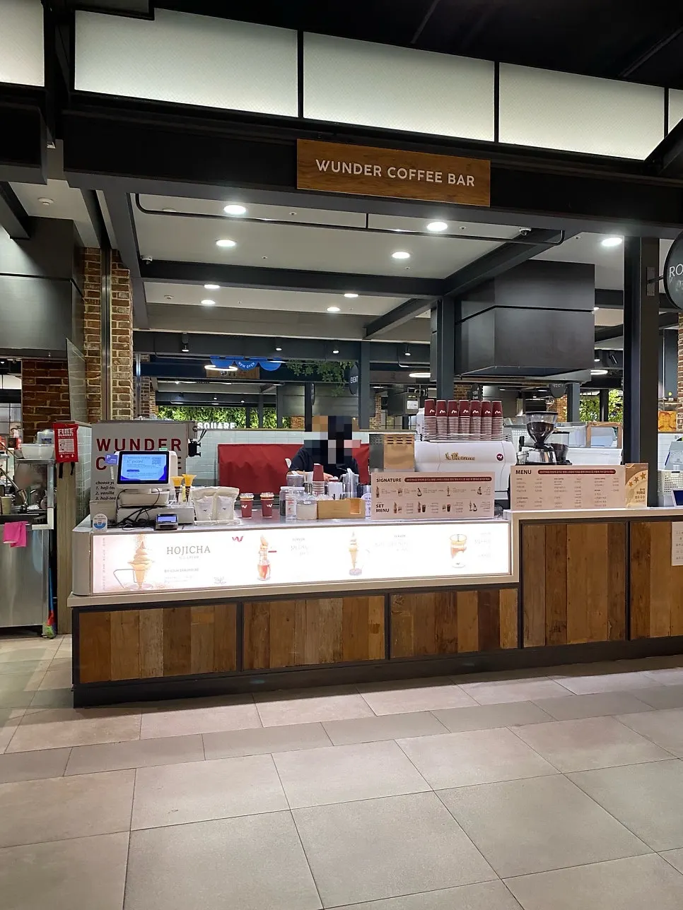 Shared tables set up around the store