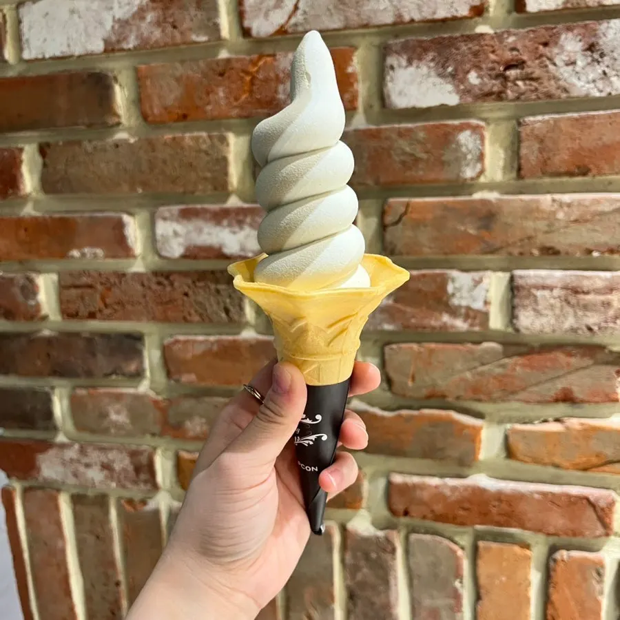 Swirl ice cream packed full all the way inside the cone