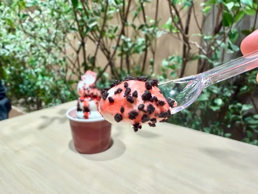 Cross-section of the Dwaejibar ice cream with strawberry syrup and chocolate topping