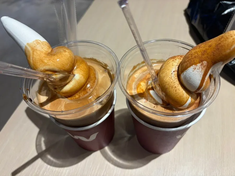 Two cups of Wunder Gato with soft-serve piled high above the cup