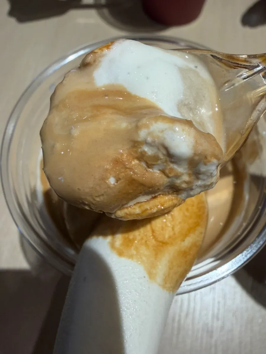 A bite of smoothly melting soft-serve ice cream