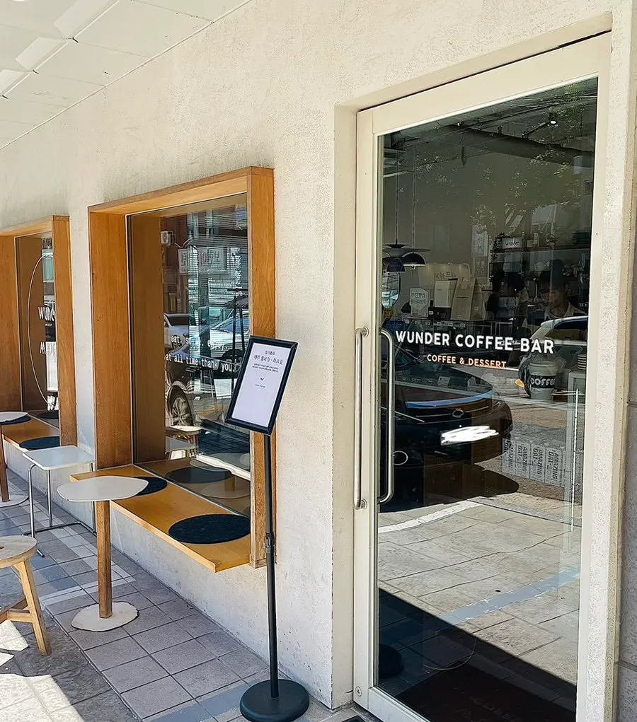 Outdoor seating and tables at Wonder Coffee Bar Yeokgok