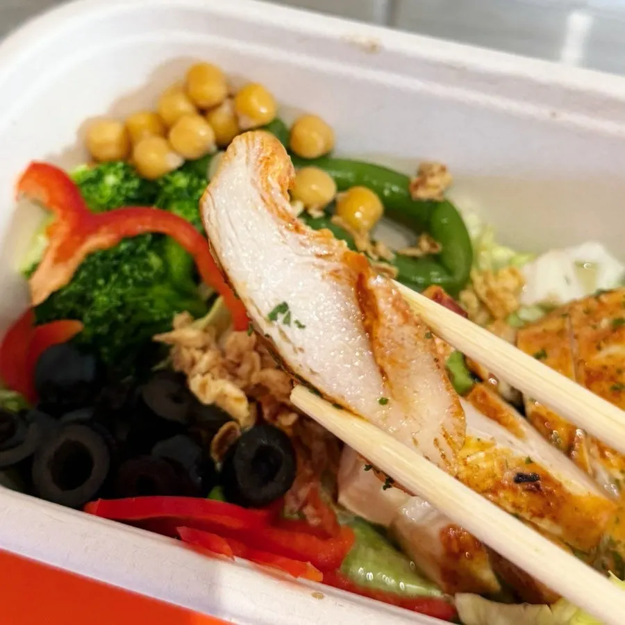 Chicken paired with lettuce, bell pepper, and olives