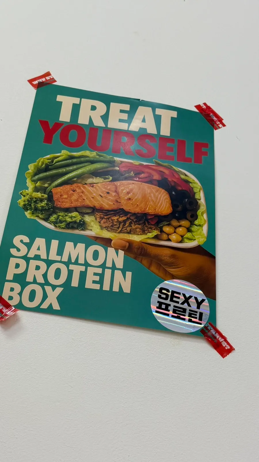 Menu sign listing the new protein rice bowl and protein pastang