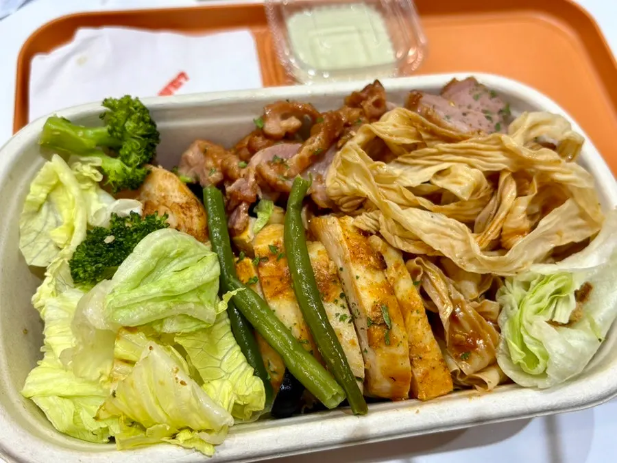 Close-up of tofu noodles coated in mala sauce