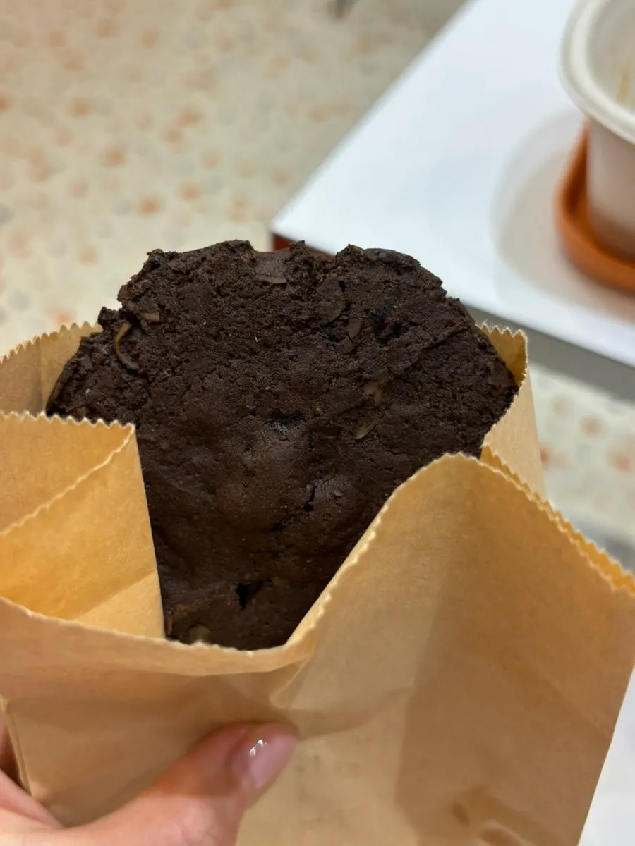 Protein chocolate cookie with nuts eaten for dessert