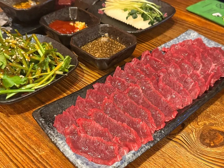 Complimentary raw liver and cheonyeop table spread