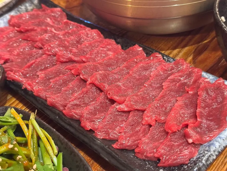 Plated beef sashimi and yukhoe