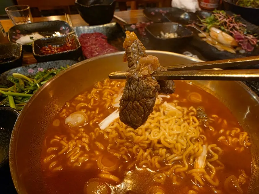 Noodles lifted up from the beef ramyeon