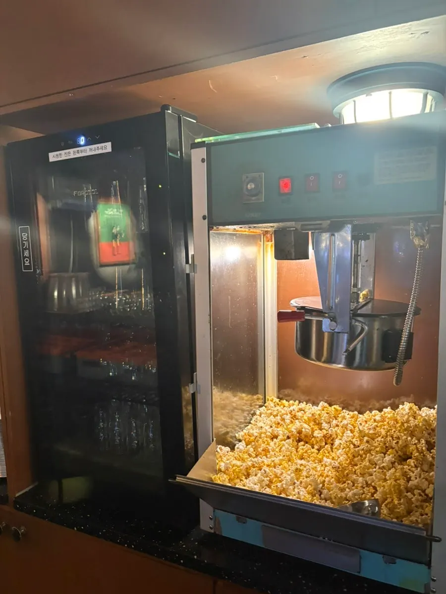 Complimentary popcorn refills from the self-serve bar