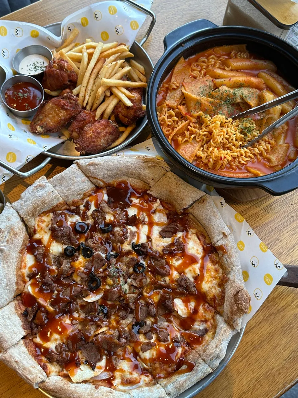 Set with bulgogi pizza, rosé tteokbokki, and wings