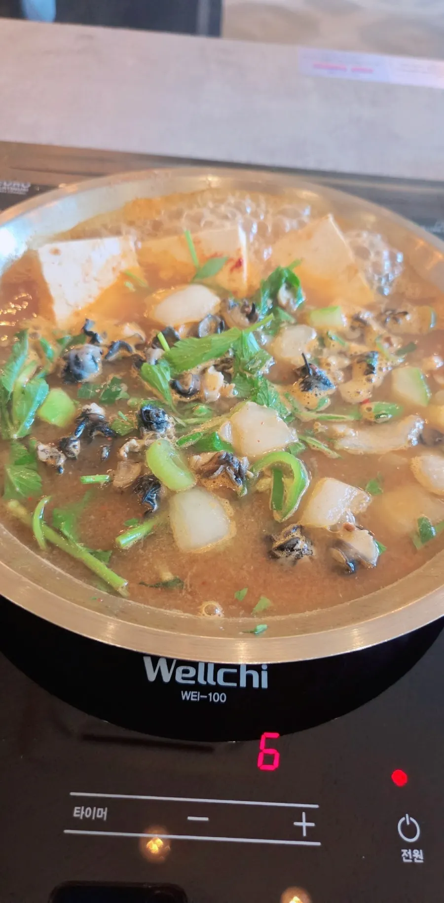 Broth and ureong in boiling doenjang hot pot