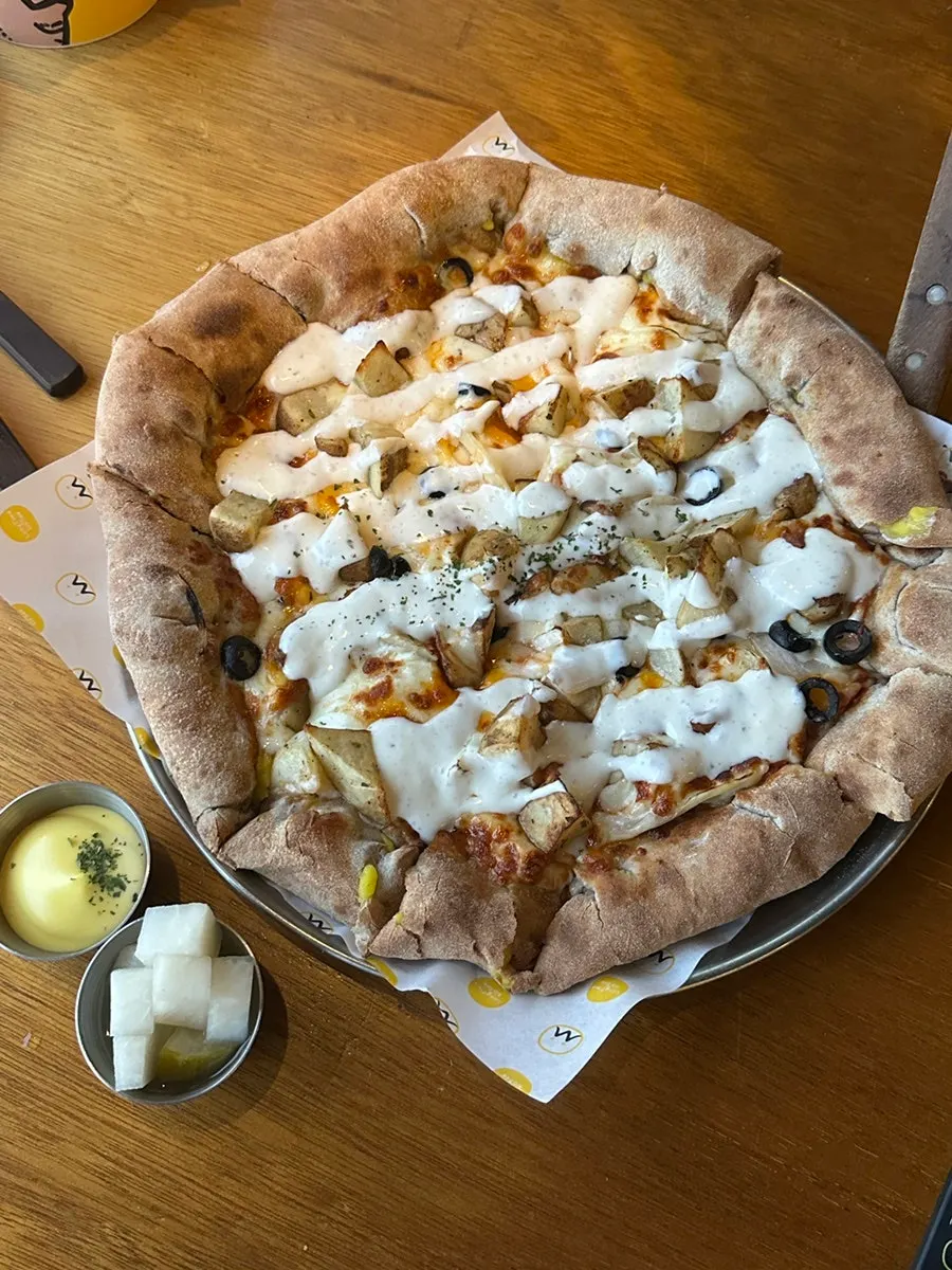 Herb garlic potato pizza loaded with sauce