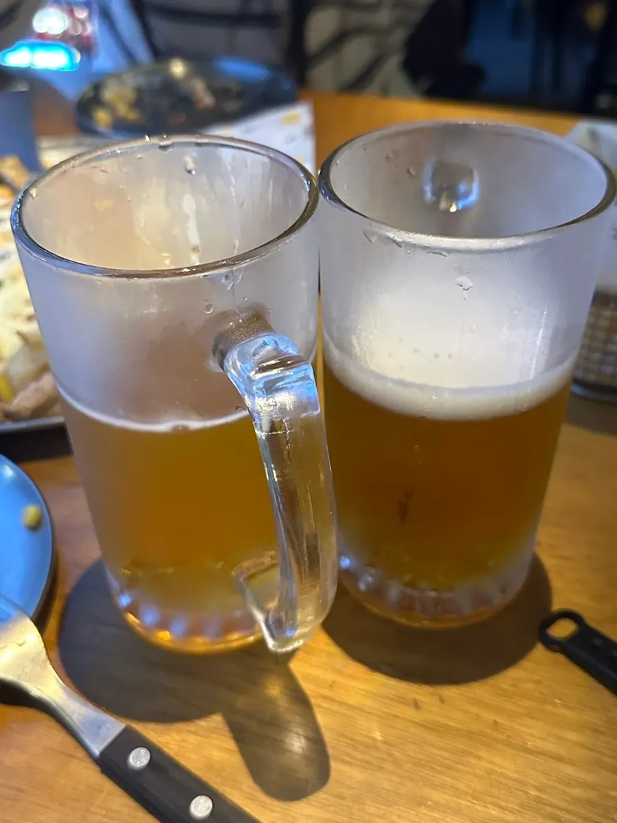 Honey butter fries with glasses of Orion and American beer