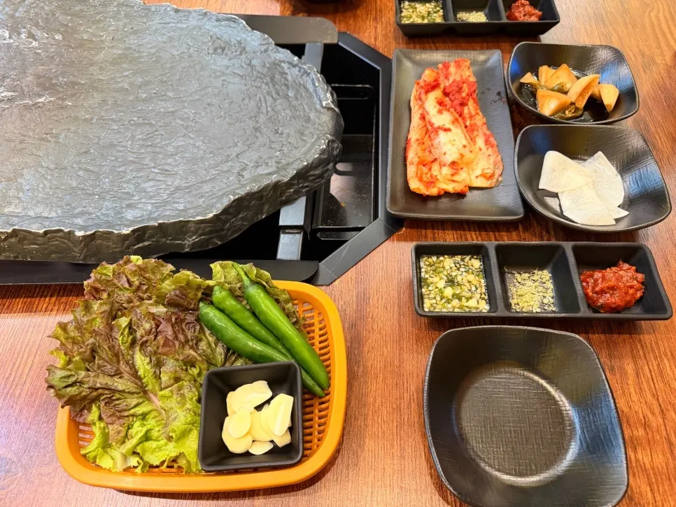 Side dishes set out before the meat arrives