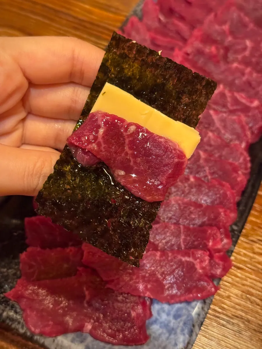 A piece of yuksashimi paired with minari