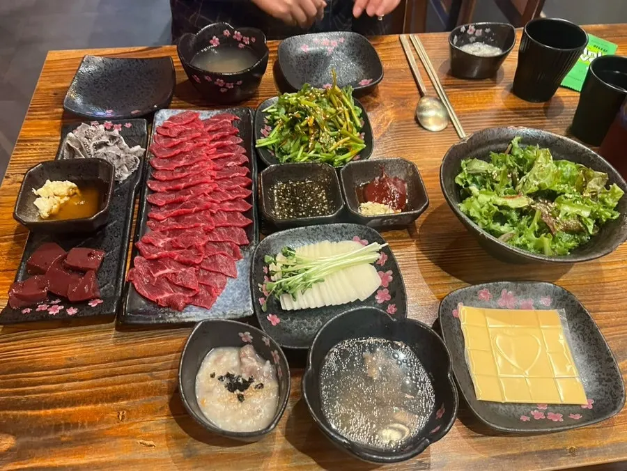 Table set with salt-oil sauce and various dips