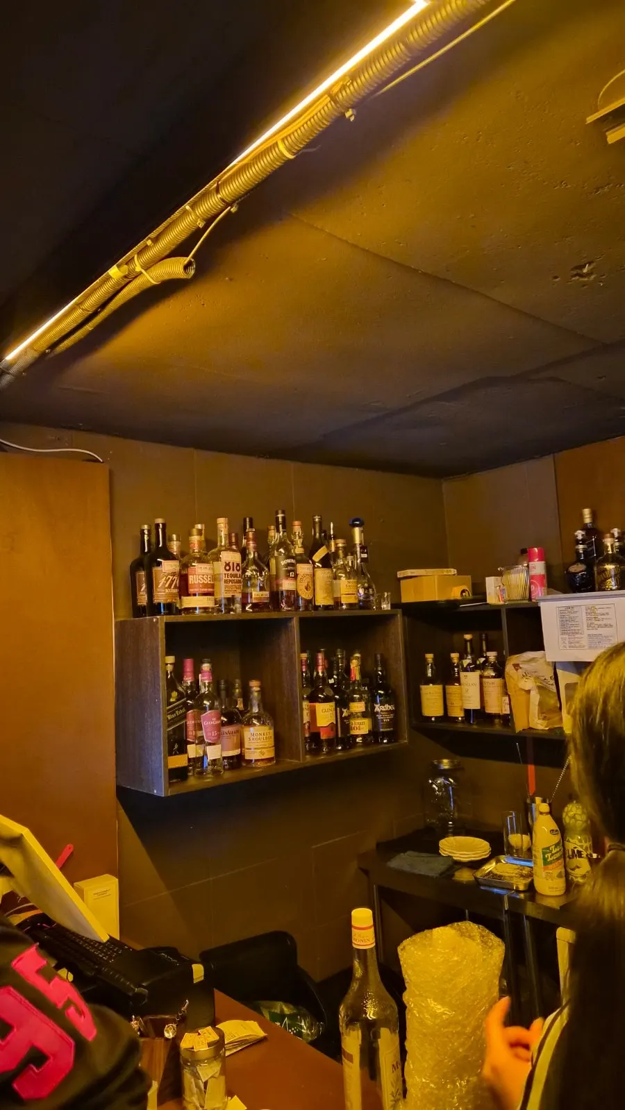 Warmly lit bar table inside Yahwa