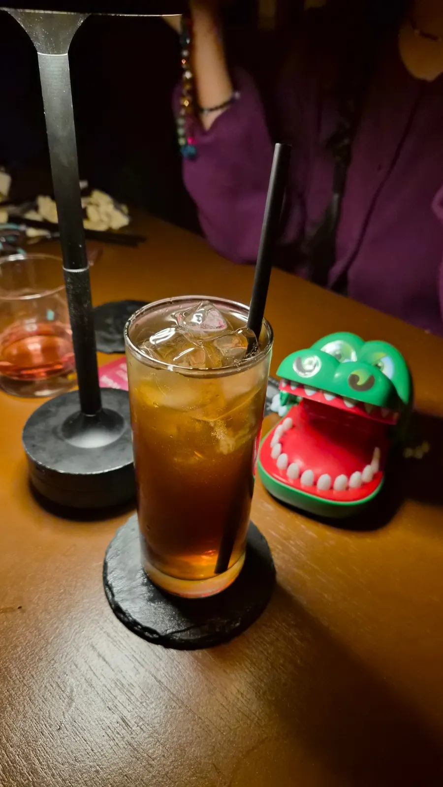 Long tea served in a glass packed with ice