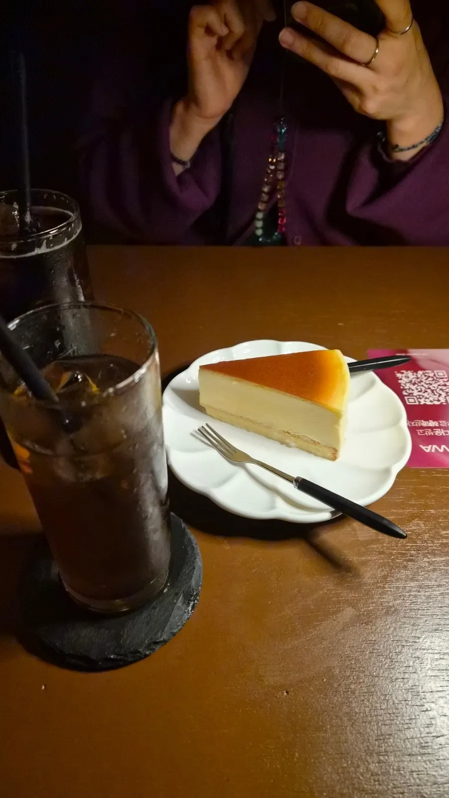 Cheesecake placed alongside the drinks
