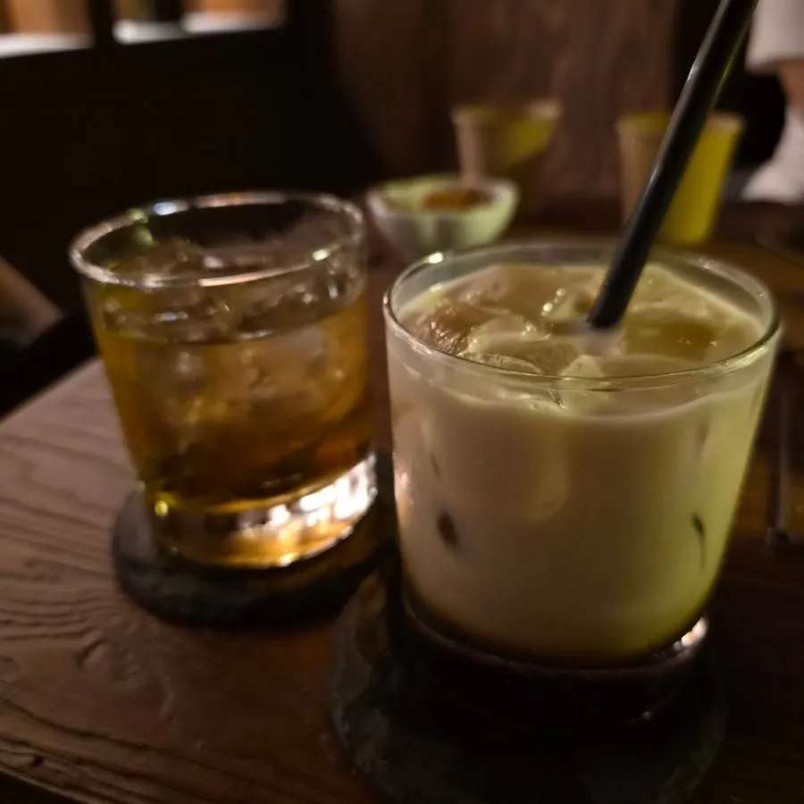 An emptied cocktail glass and the second order