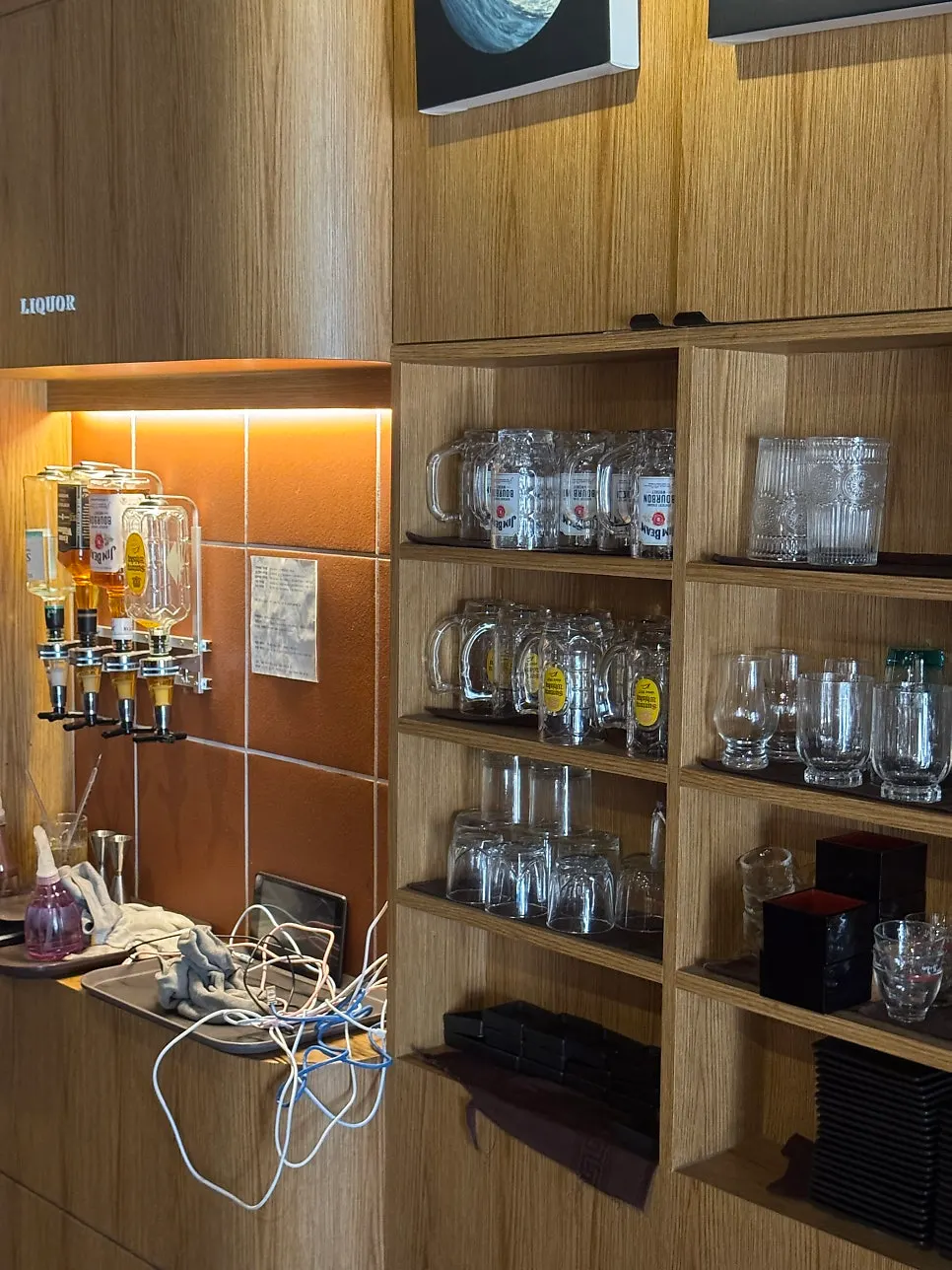 Drink shelf at Yakiniku Gaek with sake and whiskey