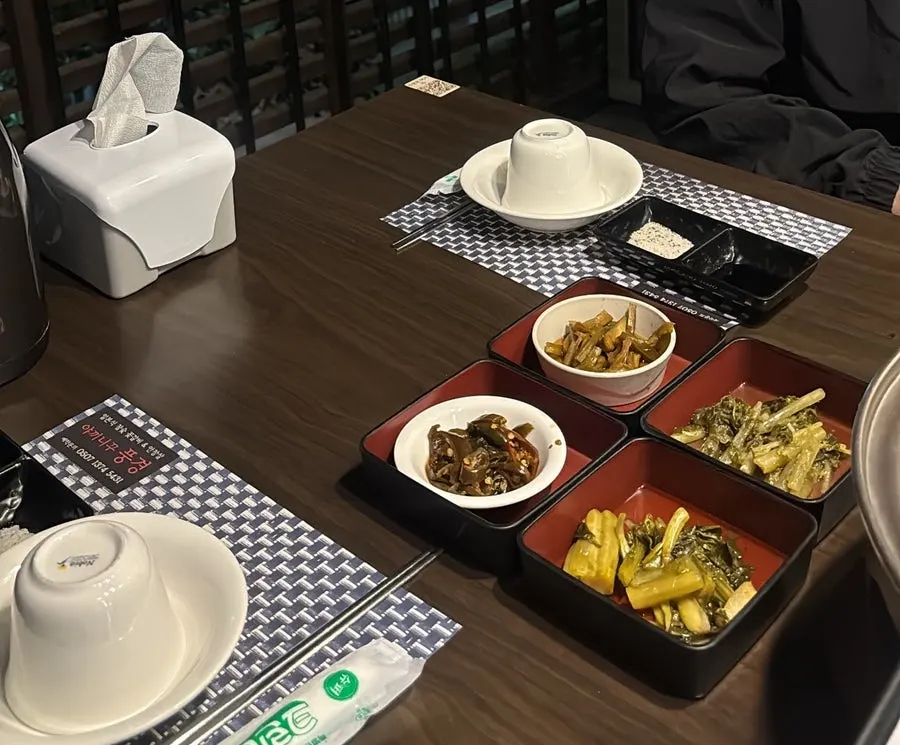 Table setting with four kinds of pickled side dishes