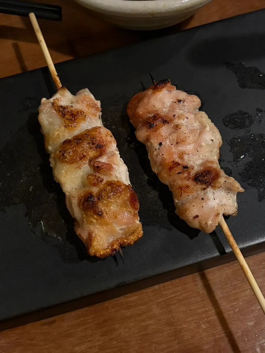 A plate of chicken heart skewers