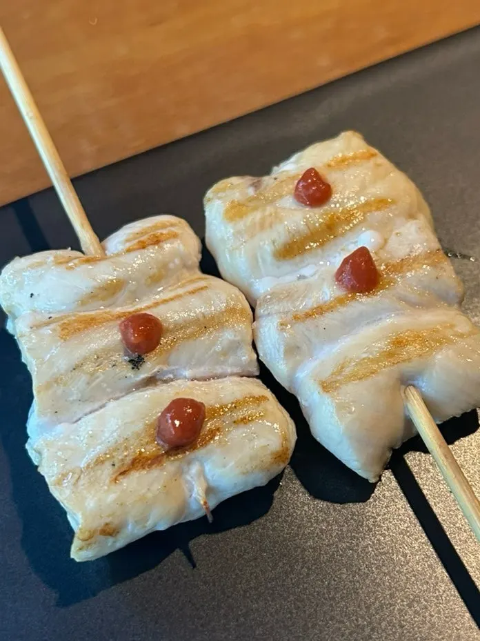 Chicken tenderloin skewer topped with plum wasabi
