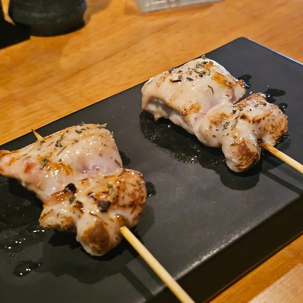 Plate of yakitori skewers from different chicken parts