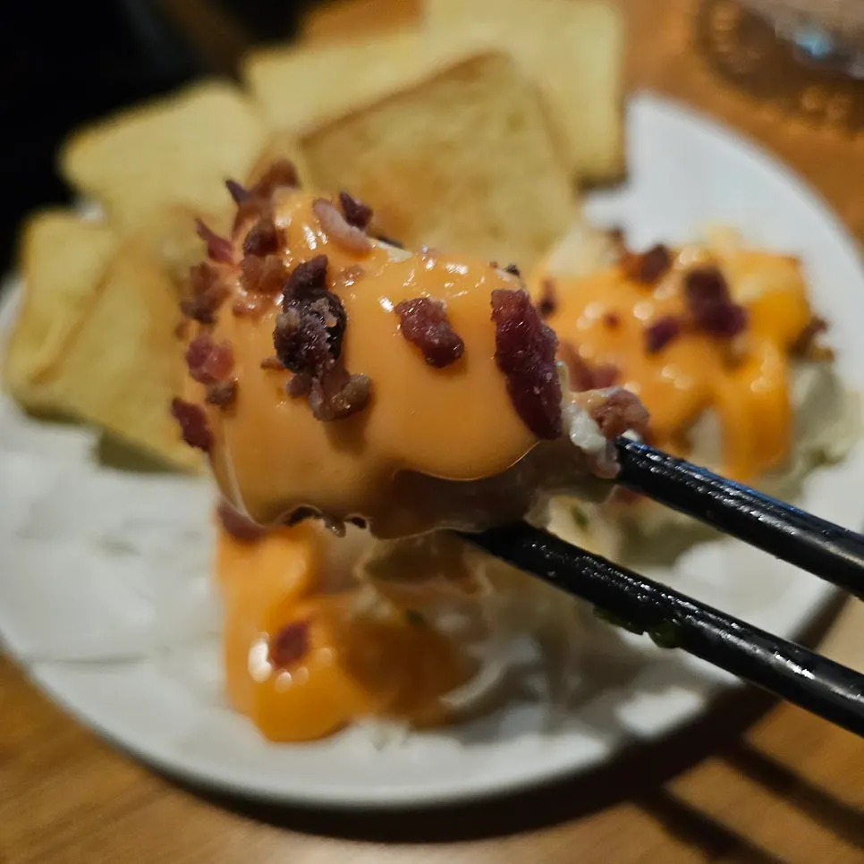 Plate of potato salad topped with cheese