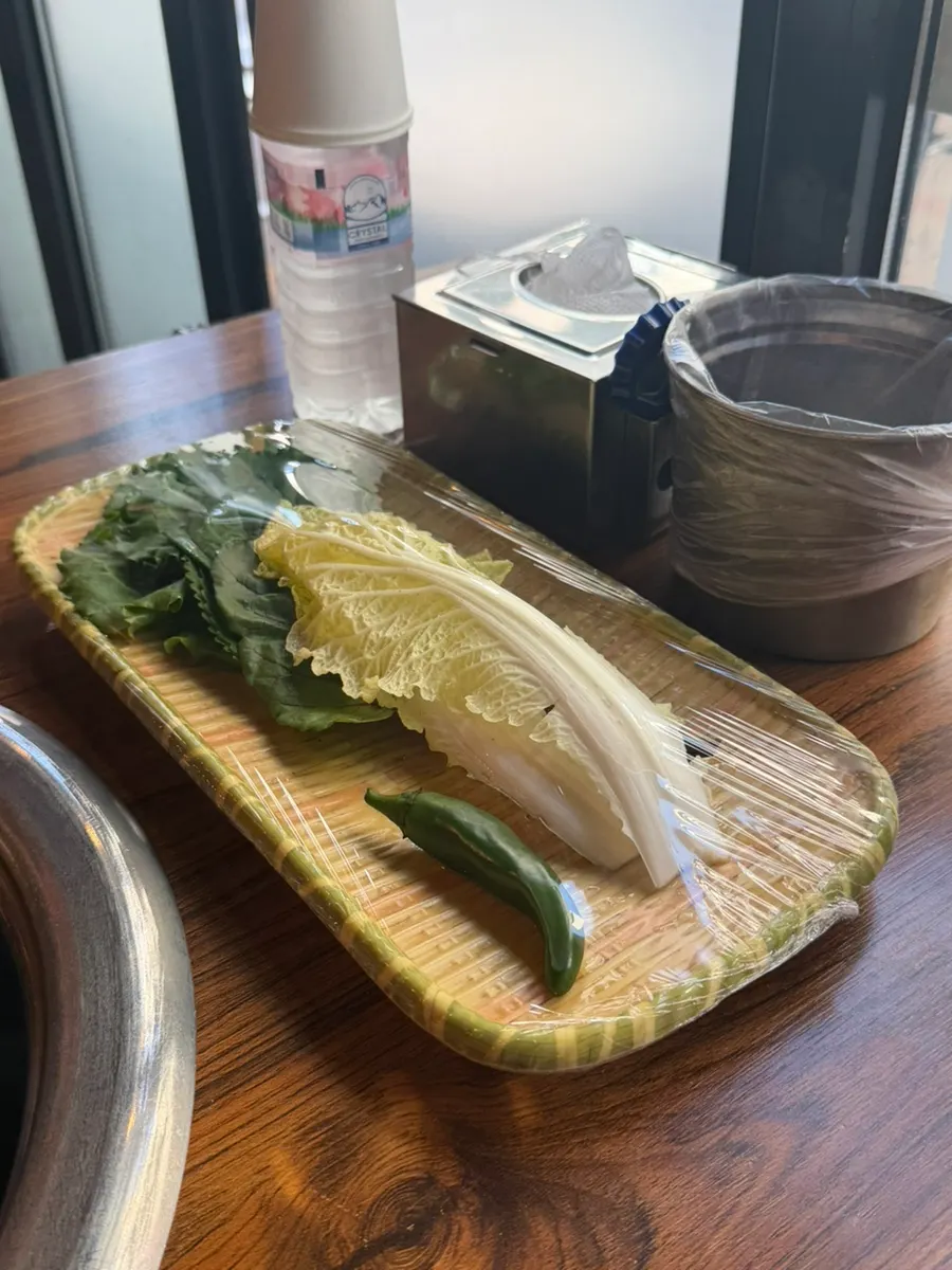 Table setting with charcoal grill placed in the center