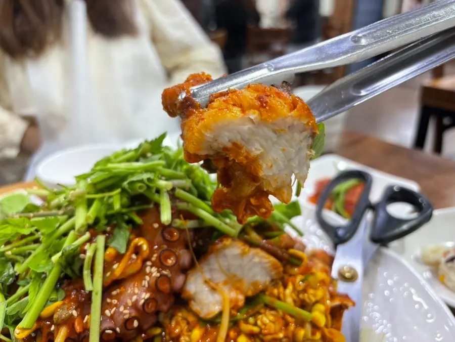 Agujjim topped with a whole octopus leg