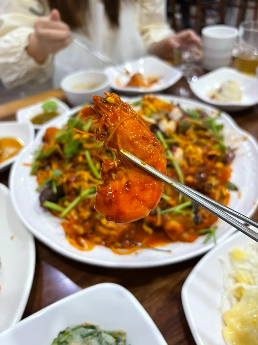 Picking up a piece of plump monkfish meat