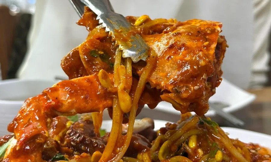 Several crabs included in the seafood stew