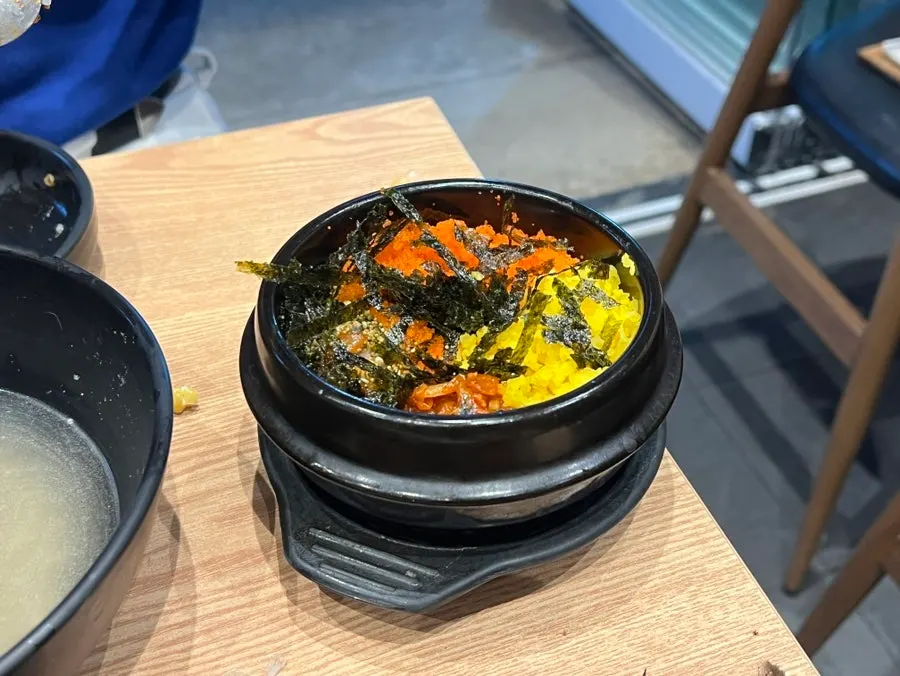 Rice bowl with fish roe served alongside the stew