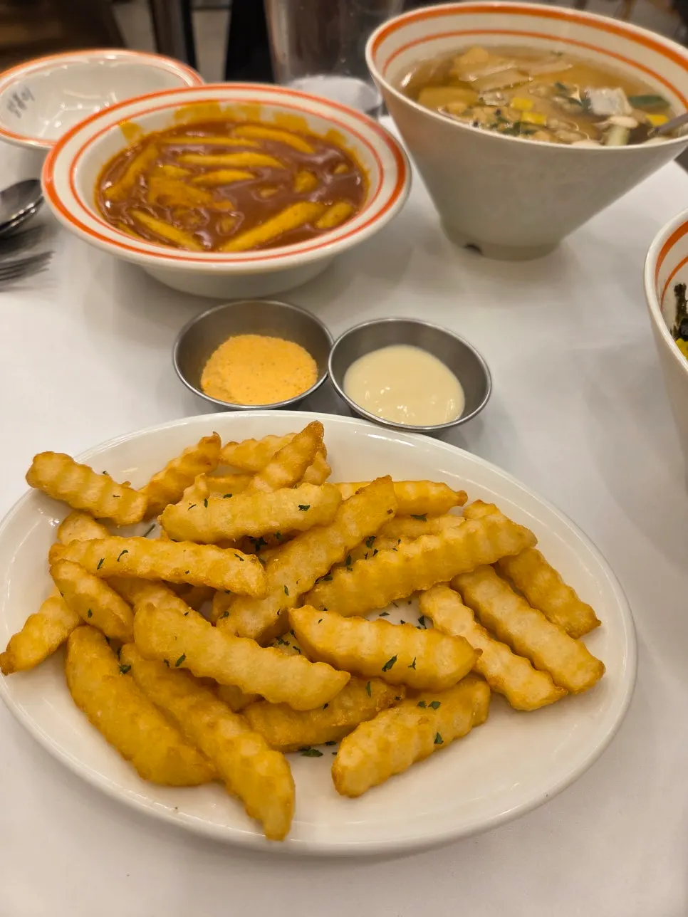 Sweet cheese fried potatoes served with seasoning on the side